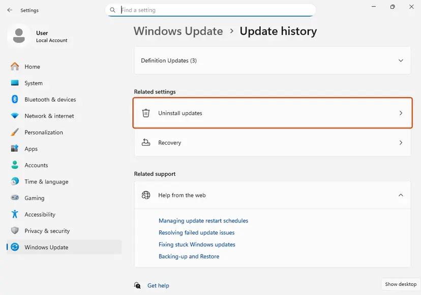 Settings, Windows Update, Update history page with Uninstall updates highlighted under Related settings